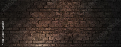 Old wall brown dark background with stained aged bricks