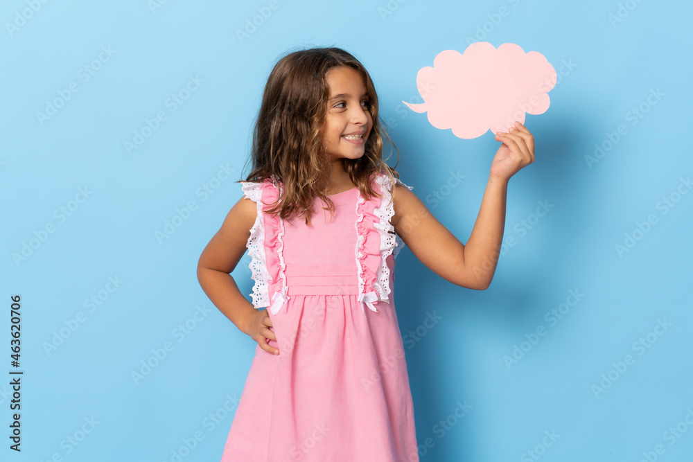 Portrait of cheerful girl holding paper cloud copy space isolated over blue background Portrait of cheerful girl holding paper cloud copy space isolated over blue background