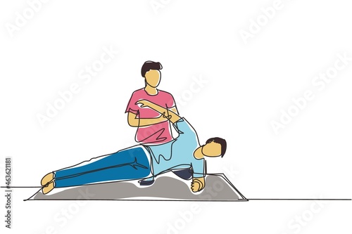 Single continuous line drawing man patient lying on the floor masseur therapist doing healing treatment massaging patient body manual sport physical therapy. One line draw design vector illustration