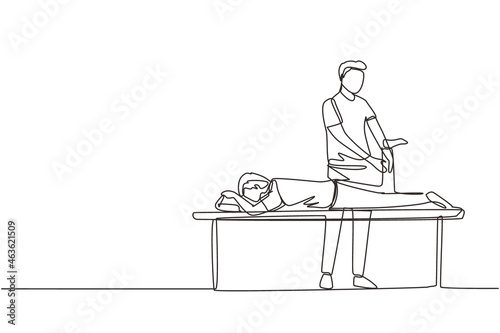 Single continuous line drawing physiotherapy rehabilitation assistance. Man patient lying on massage table therapist doing healing treatment massaging injured foot. One line draw graphic design vector