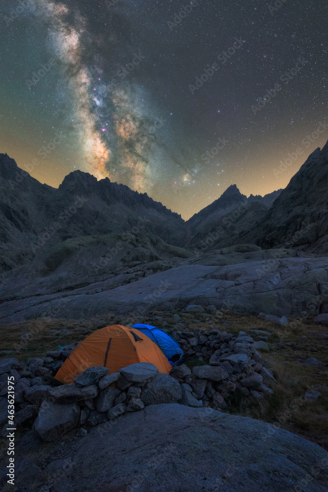 Tent in river against mount under starry sky Tent in river against mount under starry sky