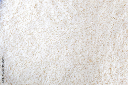 Close up of grains of jasmine rice on background.