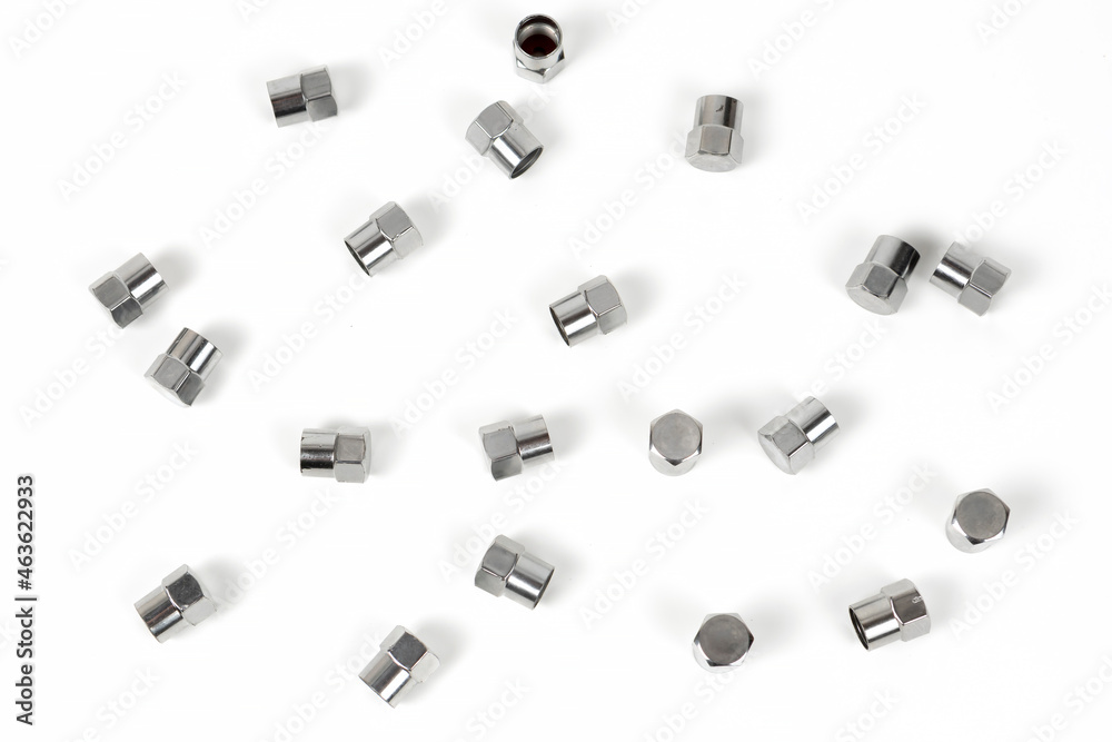 Fototapeta premium cap shiny on the valve of a wheel of a car made of silver metal. close-up. abstract background