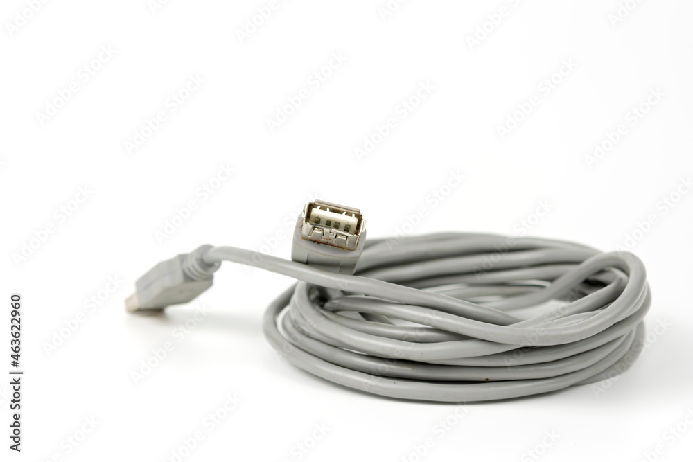 connecting cord for USB connectors of a personal computer coiled into a tight coil. copy space connecting cord for USB connectors of a personal computer coiled into a tight coil. copy space