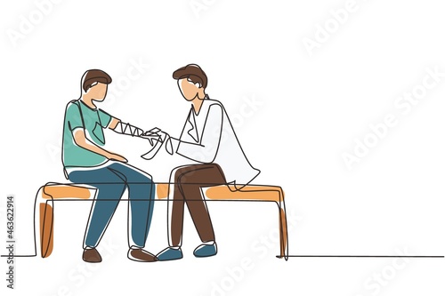 Single continuous line drawing doctor bandages patient man hand. First aid emergency hands doing dressing bandage in Traumatology clinic. Medical treatment in hospital. One line draw design vector