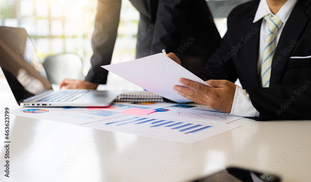 Businessmen working to discuss business planning strategies. Businessmen working to discuss business planning strategies.