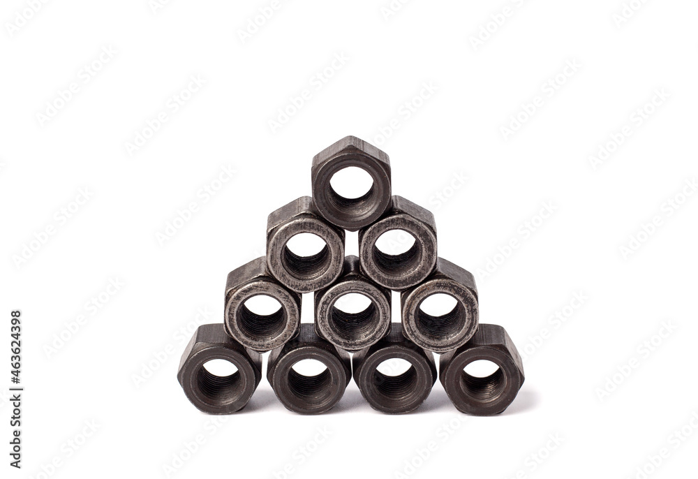 stack of metallic nuts isolated on white background. Heavy hex nut. Female screw nut with copy space. Fastener stack of metallic nuts isolated on white background. Heavy hex nut. Female screw nut with copy space. Fastener