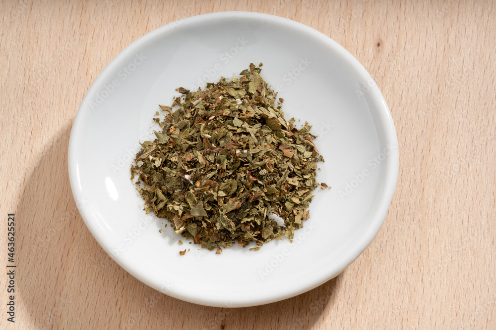 Detailed and large close up shot of lovage on a small plate Detailed and large close up shot of lovage on a small plate