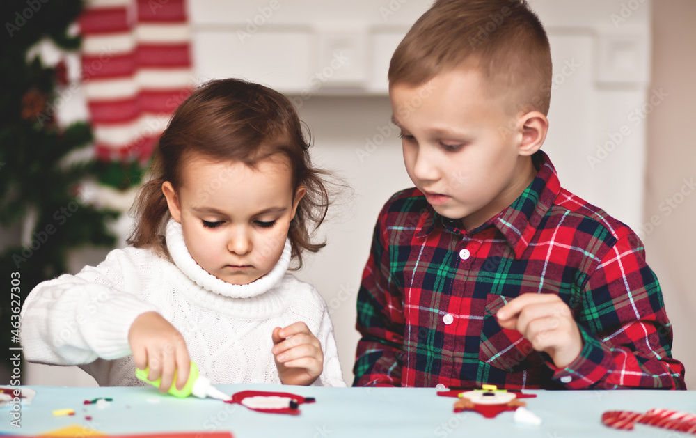 Kids making decor for Christmas tree or gifts. Christmas handmade diy project. Kids making decor for Christmas tree or gifts. Christmas handmade diy project.
