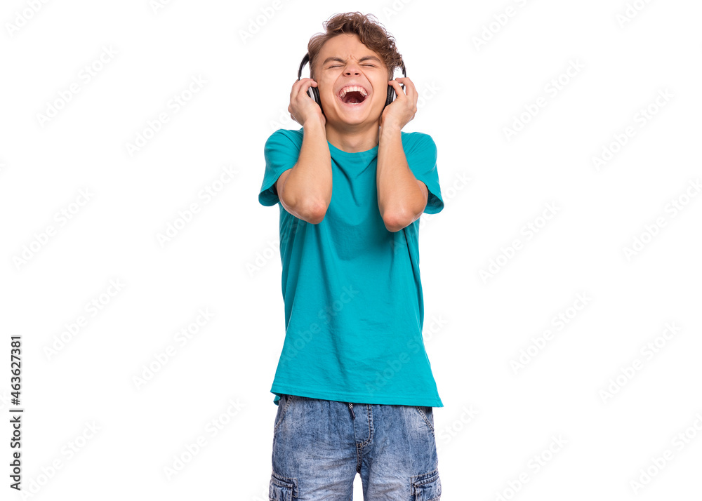 Happy teen boy with headphones, isolated on white background. Cheerful child listening to music and singing song. Emotional portrait of handsome teenager guy enjoying music Happy teen boy with headphones, isolated on white background. Cheerful child listening to music and singing song. Emotional portrait of handsome teenager guy enjoying music