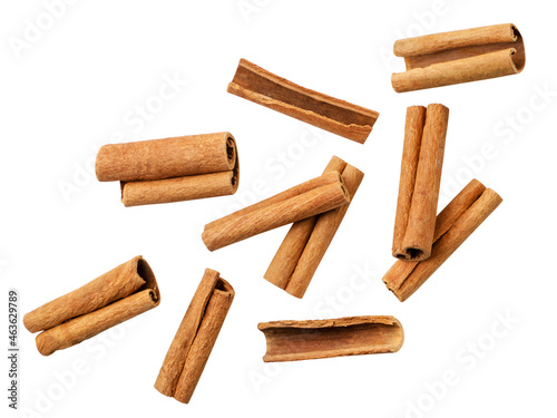 Cinnamon sticks falling on a white background, cut. Isolated