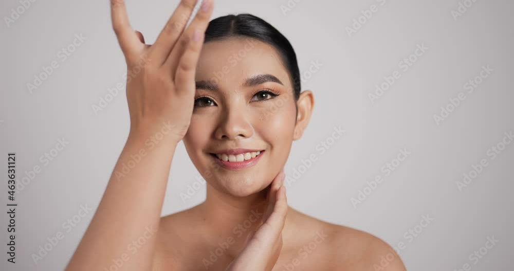 Close up of Beauty Asian woman face looking at camera Close up of Beauty Asian woman face looking at camera