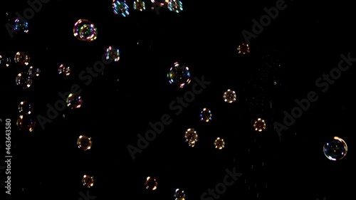 Soap Bubbles Falling Over Black Background 1