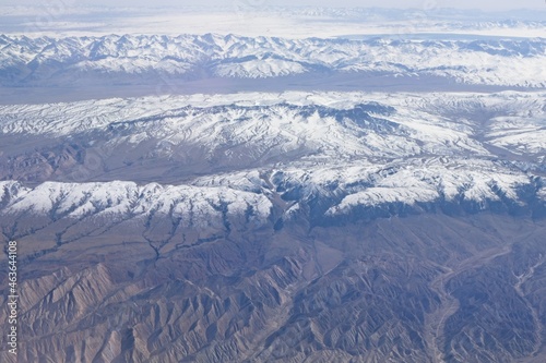 Lines of alternating snowtops and dry valleys