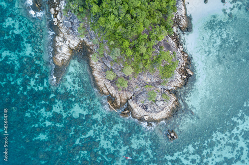 Stunning summer landscape. Aerial view of turquoise Andaman sea with reef and small island at Koh Lipe or Lipe island, Satun, Southern Thailand. Top view shot from drone