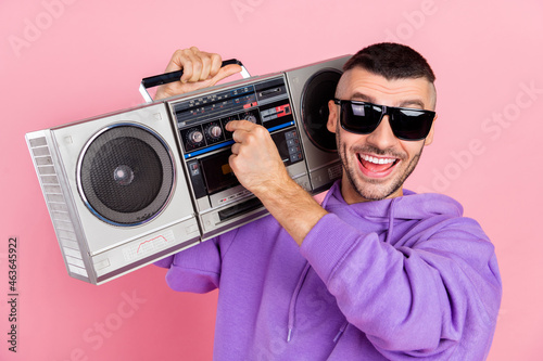 Photo of young excited man make louder music party discotheque eyeglasses isolated over pink color background