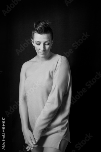 Black and white portrait of a beautiful woman with a short haircut mohawk emotions mood © Vintovka