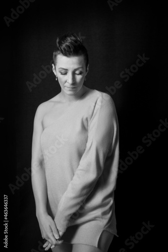 Black and white portrait of a beautiful woman with a short haircut mohawk emotions mood