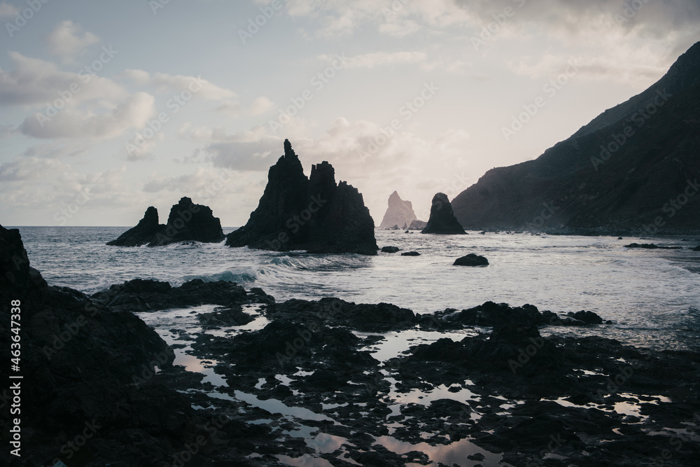 Early morning on the Playa Benijo on the north of Tenerife, Canary islands,  dramatic scenery with volcanic black sand beach and sharp cliffs in the Atlantic ocean