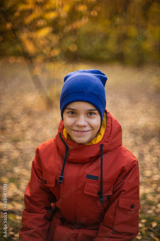 Autumn portrait of boy teen on fall nature background Autumn portrait of boy teen on fall nature background