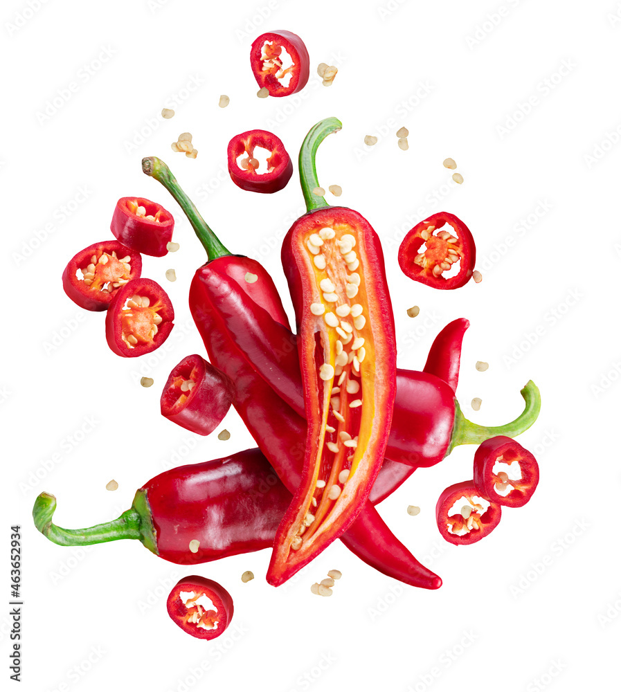 Fresh red chilli peppers and cross sections of chilli pepper with seeds floating in the air. File contains clipping paths. - obrazy, fototapety, plakaty 