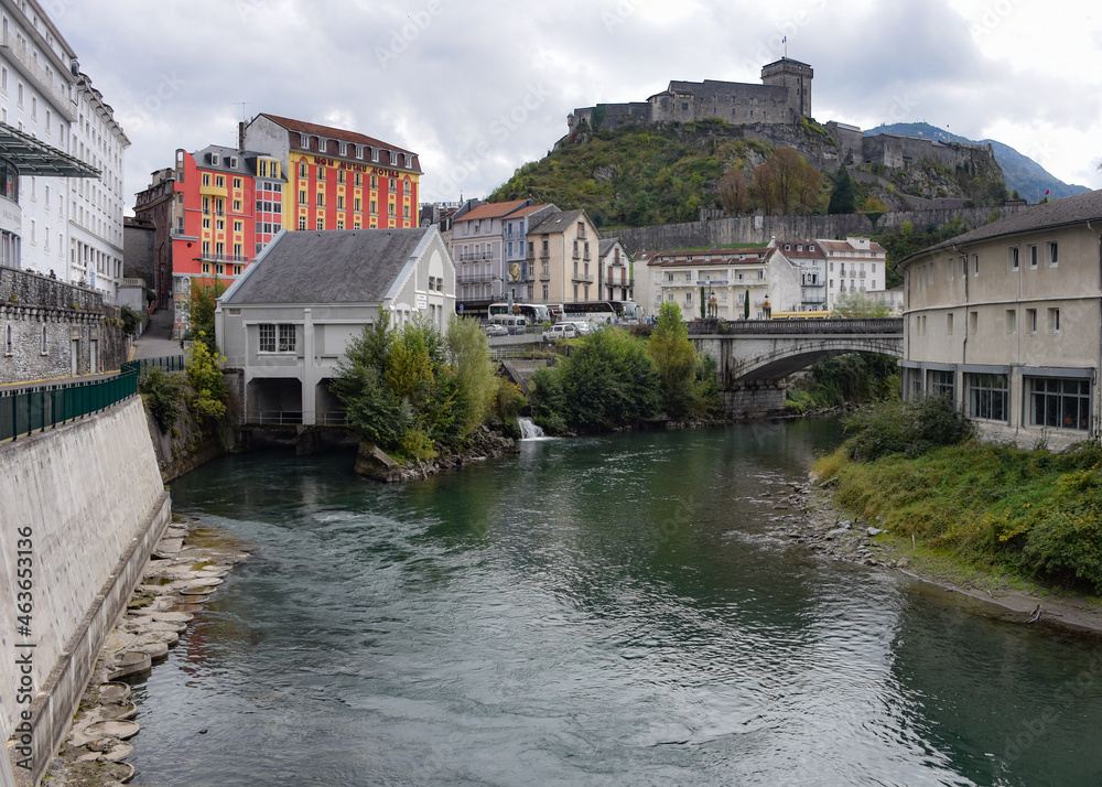 Lourdes, France - 9 Oct, 2021: Views along the River Ousse towards Lourdes Castle and Pyrenees Museum