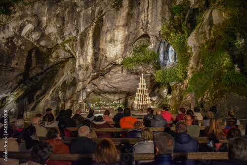 Obraz na plátně Lourdes, France - 9 Oct 2021: Evening Mass service at the Massabielle Grotto, Ro