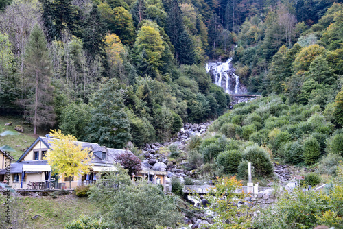 Cauterets, France - 10 Oct 2021: Waterfalls cascade from the Pyrenees mountains near La Raillere springs photo