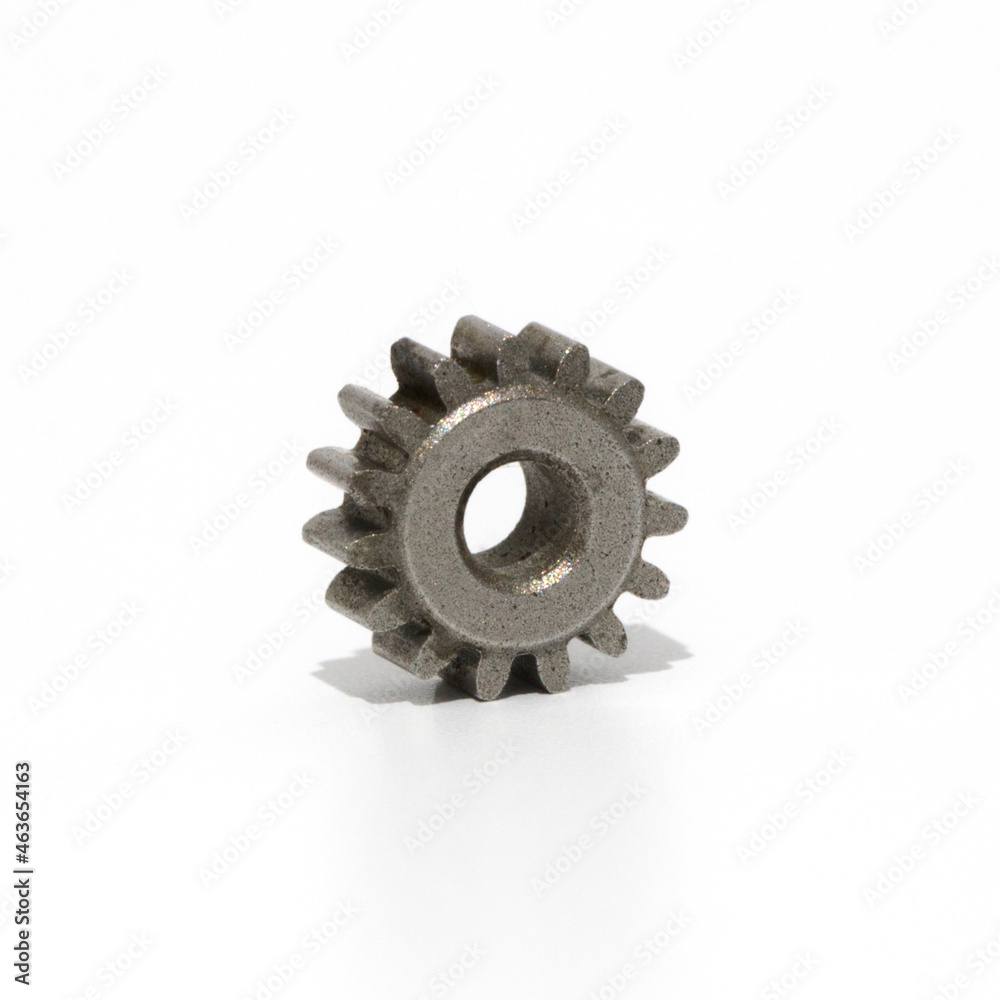 Mini metal cog wheel isolated on white background. Mini metal cog wheel isolated on white background.