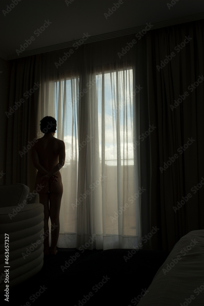 Woman alone hotel bedroom