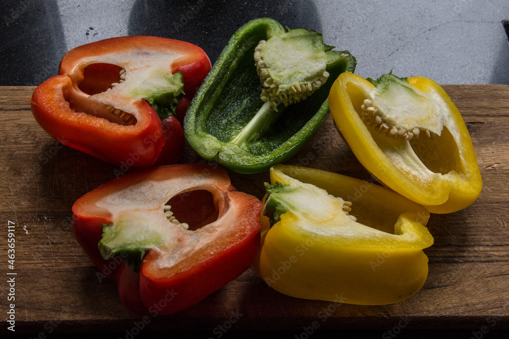 stillife in the kitchen with red, yellow and green peppers stillife in the kitchen with red, yellow and green peppers