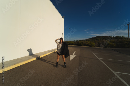 YOUNG GIRL WITH ZEBRA PRINT IN PARKING