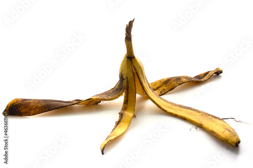Rotten banana peel isolated on white background. Food waste. photo