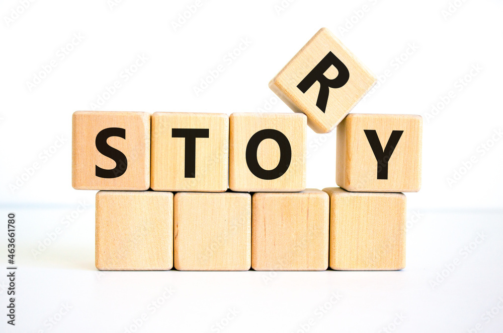 Story and storytelling symbol. The concept word 'story' on wooden cubes. Beautiful white table, white background. Business story and storytelling concept. Copy space. Story and storytelling symbol. The concept word 'story' on wooden cubes. Beautiful white table, white background. Business story and storytelling concept. Copy space.