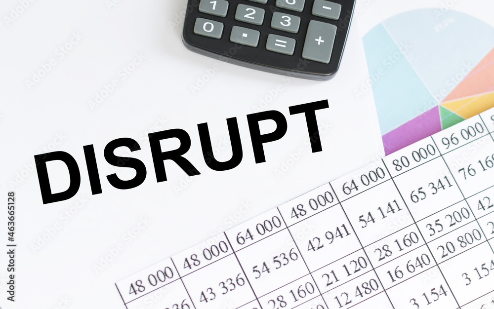 disrupt text on a white background next to numbers on paper and colored slides, calculator disrupt text on a white background next to numbers on paper and colored slides, calculator