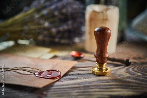 Sealing wax on ancient papers, antique stamp, and old documents, brass spoon 