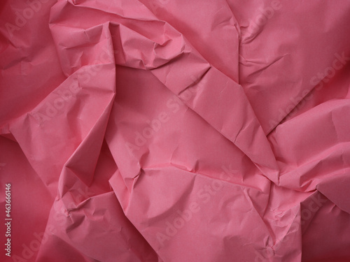 A crumpled pink paper background