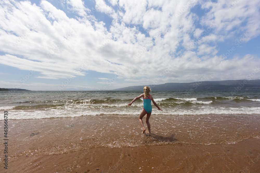 Child playing on the beach