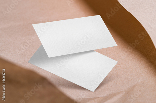 Clean minimal business card mockup on craft paper with shadow