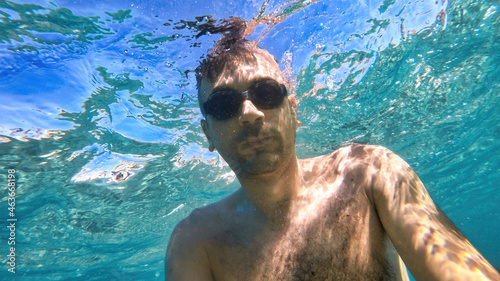 Man swimming under the water, Mediterranean sea