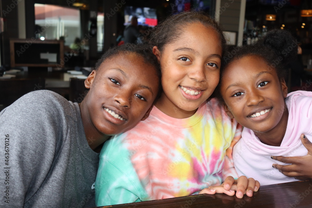 Three Black Girls smiling indoors close up - obrazy, fototapety, plakaty 