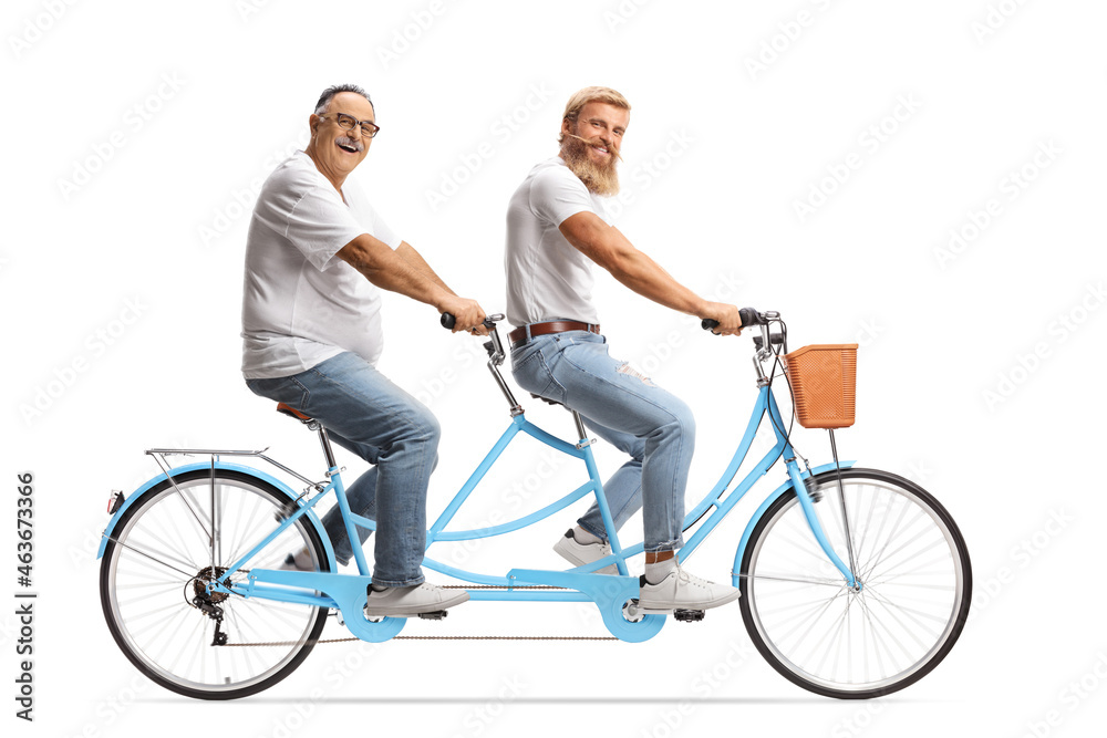 Young and mature man riding a tandem bicycle Young and mature man riding a tandem bicycle