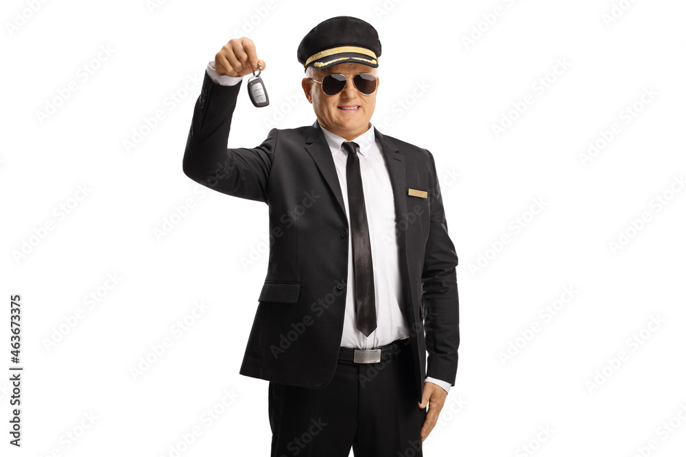 Chauffeur in a uniform with sunglasses holding a car key