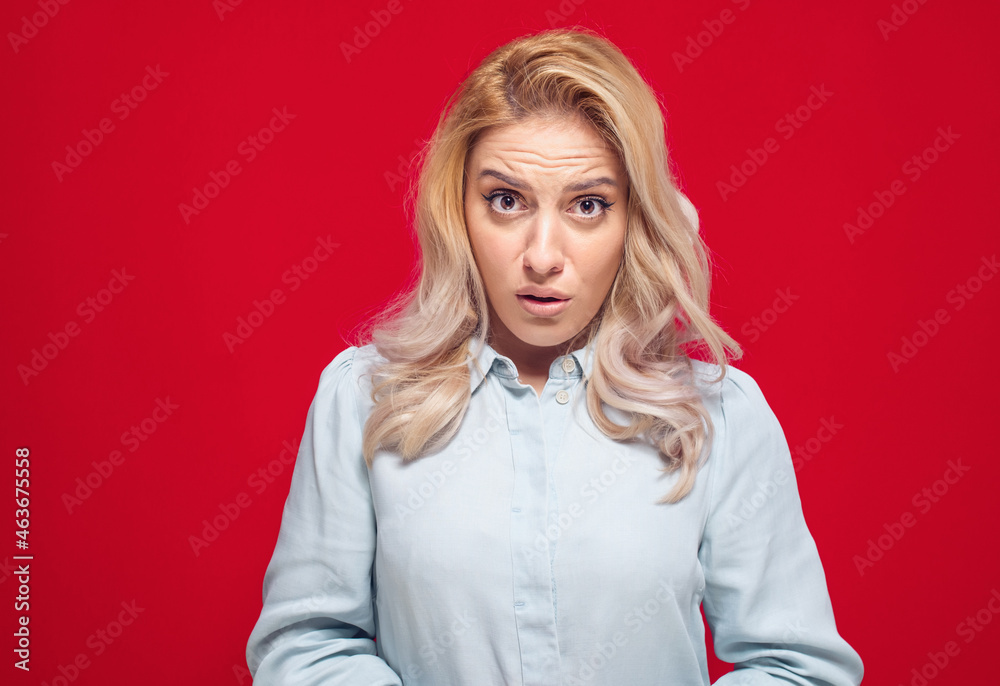 Impressed young woman looking at camera and say what, isolated on white background Impressed young woman looking at camera and say what, isolated on white background