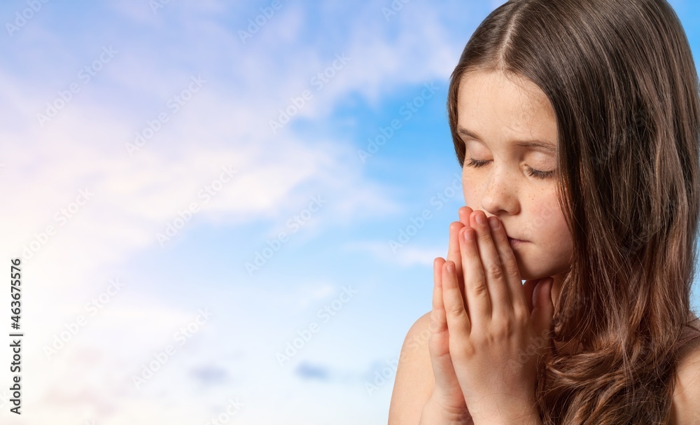 little child praying to God with hands together and a smile little child praying to God with hands together and a smile