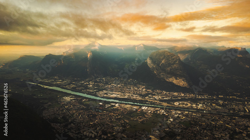 Aerial view of Grenoble alps mountains during cloudy sunset