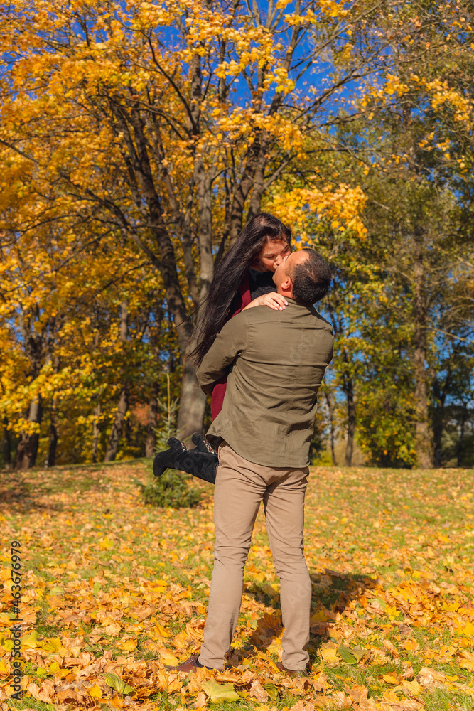 Lovely couple having fun together in nature. Boyfriend carrying his girlfriend in his arms. Lovely couple having fun together in nature. Boyfriend carrying his girlfriend in his arms.