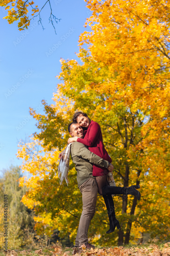 Lovely couple having fun together in nature. Boyfriend carrying his girlfriend in his arms. Lovely couple having fun together in nature. Boyfriend carrying his girlfriend in his arms.