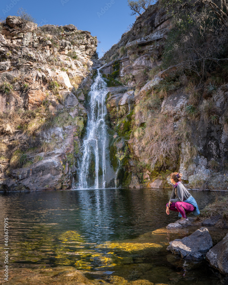 person sitting on the rocks