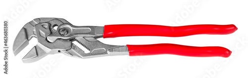 Adjustable wrench or tongue-and-groove pliers isolated on white background. Metal hand work tool with opened jaws and red plastic handles. For holding, gripping and turning or clamping and tightening. photo